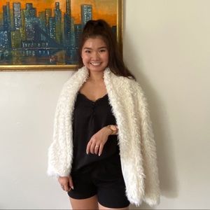 White faux fur coat